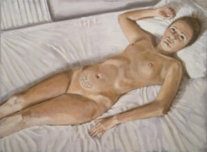 nude woman lying on bed