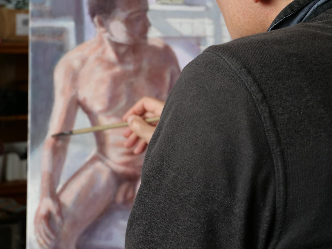 figurative artist peter d'alessandri working on his painting man and woman