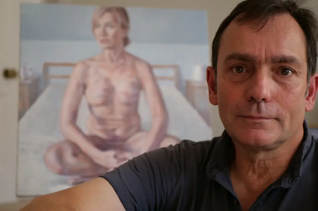 artist with his painting woman on bed, silver medal award winner at the cancer feminine 2023