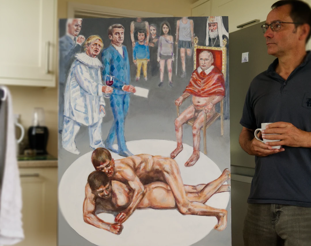 the artist peter d'alessandri with his painting men wrestling, featuring a naked Putin and a drunk Boris Johnson