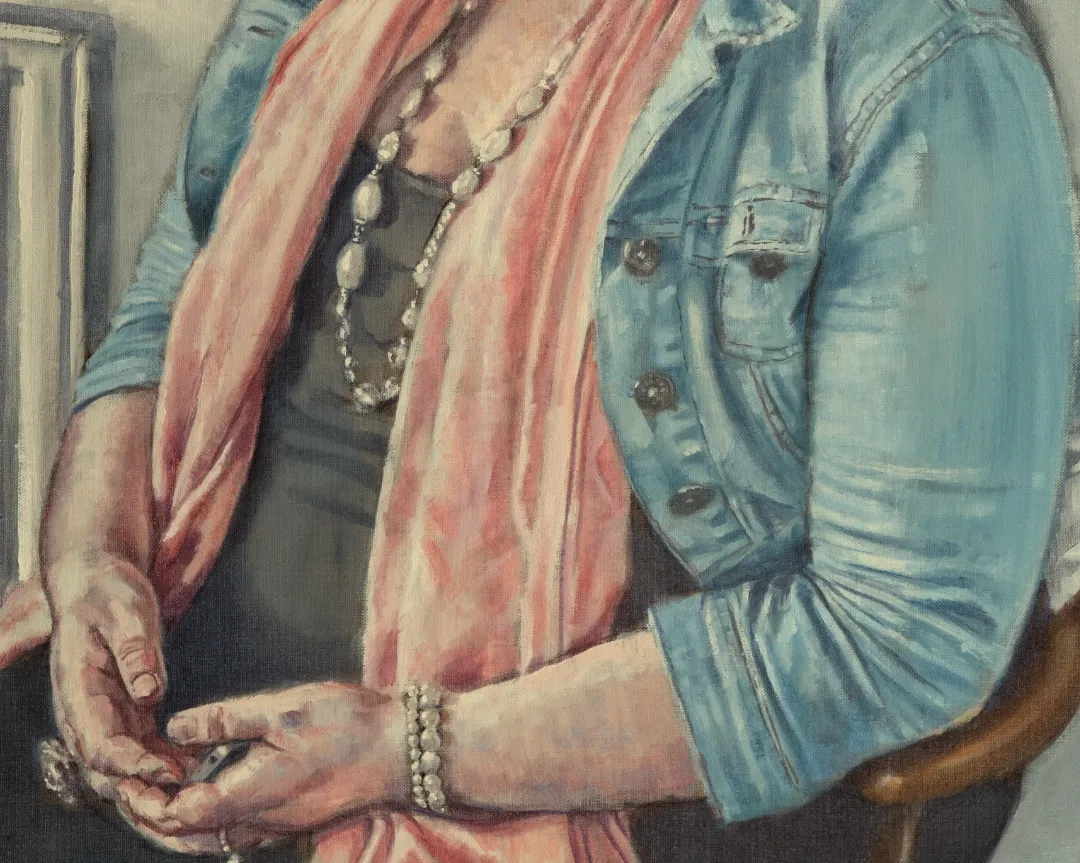 detail of portrait of woman in blue denim jacket